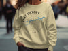 Light yellow crewneck sweatshirt with Lake Hickory North Carolina compass graphic.