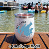 White insulated travel tumbler featuring a blue map graphic and Leech Lake Minnesota text on wooden deck by a lake with boats and swimmers.