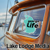 Teal shape of Lake George with "george LIFE" text above "Lake Lodge Media" logo.