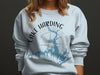 Light blue sweatshirt with a map of Lake Harding, Georgia and compass graphic.