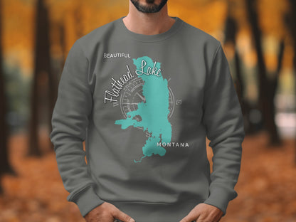 Sweatshirt with turquoise Flathead Lake, Montana map and compass graphic.