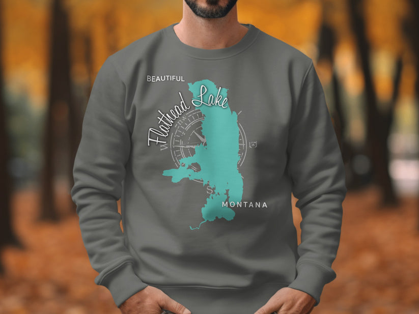 Sweatshirt with turquoise Flathead Lake, Montana map and compass graphic.
