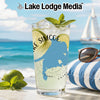 Glass with Lake Simcoe map, ice, lime, mint, and beach background.