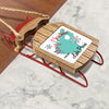 Wooden Christmas ornament shaped like a sled, reading "Merry Christmas FROM Lake Peris".