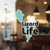 Teal lizard shape graphic with black "Lizard Life" text on glass.