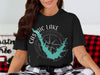 Black t-shirt with Castaic Lake, California graphic and compass rose design.