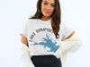 White t-shirt featuring Lake Rampart Colorado map graphic and compass design.