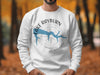 White sweatshirt with a compass design and "Lake Rayburn Arkansas" text.