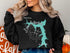 Black sweatshirt with a teal map of Lake of the Ozarks, Missouri.