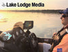 Tractor seat, fishing boat dashboard, man in life vest, "Lake Lodge Media" text.