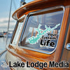 Turquoise lake outline sticker on boat window above text "Your Custom Life."