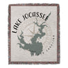Woven blanket featuring a green silhouette of Lake Jocassee and a compass rose.