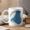 White mug with blue Emerald Lake map and compass design, "CANADA" text.