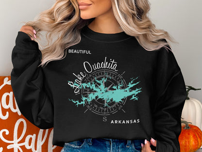 Black sweatshirt with "Lake Ouachita Arkansas" and compass graphic.