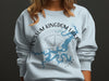 Light blue sweatshirt with Possom Kingdom Lake map and compass graphic and text.