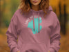 Pink hoodie with a distressed teal South Carolina map and compass graphic.