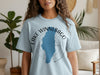 Light blue t-shirt with blue Lake Winnebago shape and compass graphic.