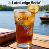 Glass with iced tea, lemon slice, and Lake Travis map design.