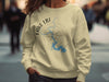 Light yellow sweatshirt with Lake LBJ map, compass, and Texas text.