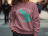 Salmon pink sweatshirt with turquoise Lake Lawtonka map and compass design.