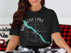 Black t-shirt with "Maligne Lake Canada" text and compass graphic.