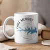 White mug with Lake Murray map and compass design, steam rising.
