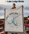Lake Sinclair Georgia map blanket with fringe, held by a smiling man.