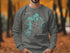 Dark grey crewneck sweatshirt with "Pomm de Terre Lake Missouri" and compass design.