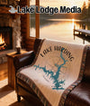 Lake Harding Georgia map woven throw blanket on a leather sofa.