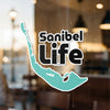 Sanibel Life sticker with turquoise island shape and black text on a window.