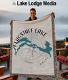 Tapestry throw with Flagstaff Lake map and compass design, "Maine" text.