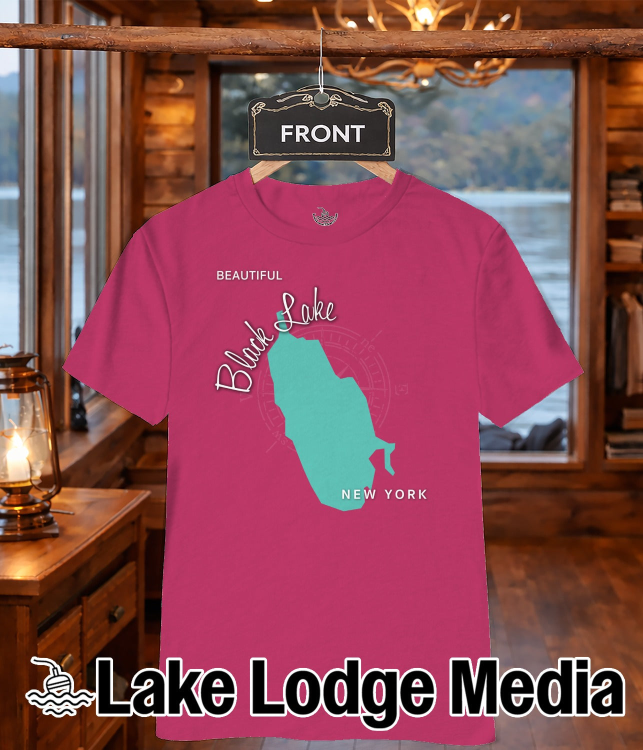 Pink t-shirt featuring a teal map outline of a lake and "Black Lake NEW YORK" text.