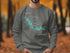 Gray sweatshirt with a teal compass and Lake Tobesofkee map design.