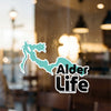 Türk Life sticker on a window with a teal lake outline and black text.