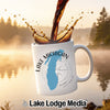 White mug with Lake Michigan map and compass, coffee pouring.