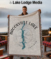 Brookville Lake Indiana map woven blanket held by smiling man, with campfire scene.