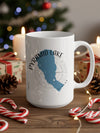 White mug with Pyramid Lake, Nevada map and compass design on a festive background.