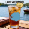 Glass of iced tea with "Water Lake" design, lemon slice, and Lake Lodge Media logo.