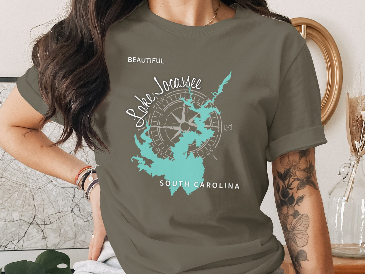 Olive green t-shirt with "Lake Jocassee South Carolina" in turquoise map outline.