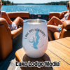 A white wine tumbler featuring a blue map of Lake Ray Hubbard rests on a boat table.
