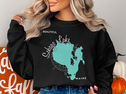 Black sweatshirt with Sebago Lake Maine map and compass design.