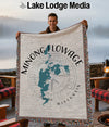 Man holding a Minong Flowage Wisconsin map blanket with compass design.