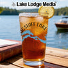 Glass of iced tea with lemon, "Flagstaff Lake Maine" design, on wooden table.