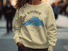 Light yellow sweatshirt with Lake Superior map and compass design.
