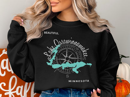 Black sweatshirt with "Lake Ossawinamakee Minnesota" text and compass graphic.