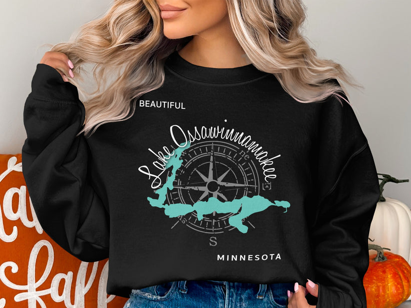 Black sweatshirt with "Lake Ossawinamakee Minnesota" text and compass graphic.