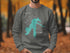 Grey sweatshirt with a teal map outline of Lake Dillon and compass graphic.