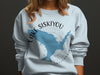 Light blue sweatshirt with Lake Siskiyou California map graphic and compass detail.