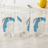 Three clear glasses featuring blue lake maps and compass designs.
