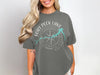 Gray t-shirt with Fort Peck Lake Montana compass graphic and map outline.
